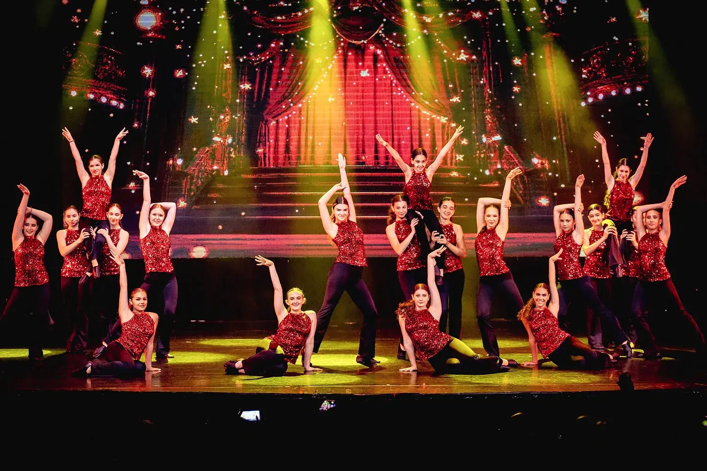 Dancers in expressive modern movement on stage