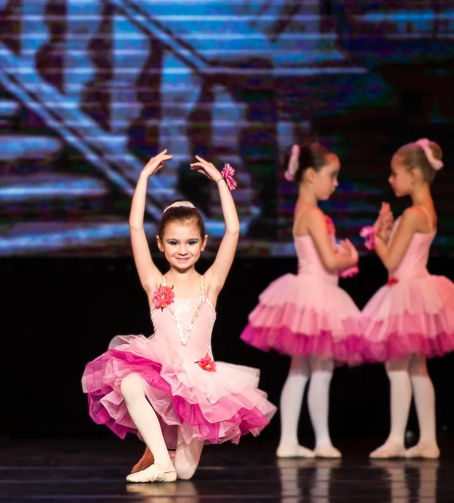 Young dancers in tutus on stage